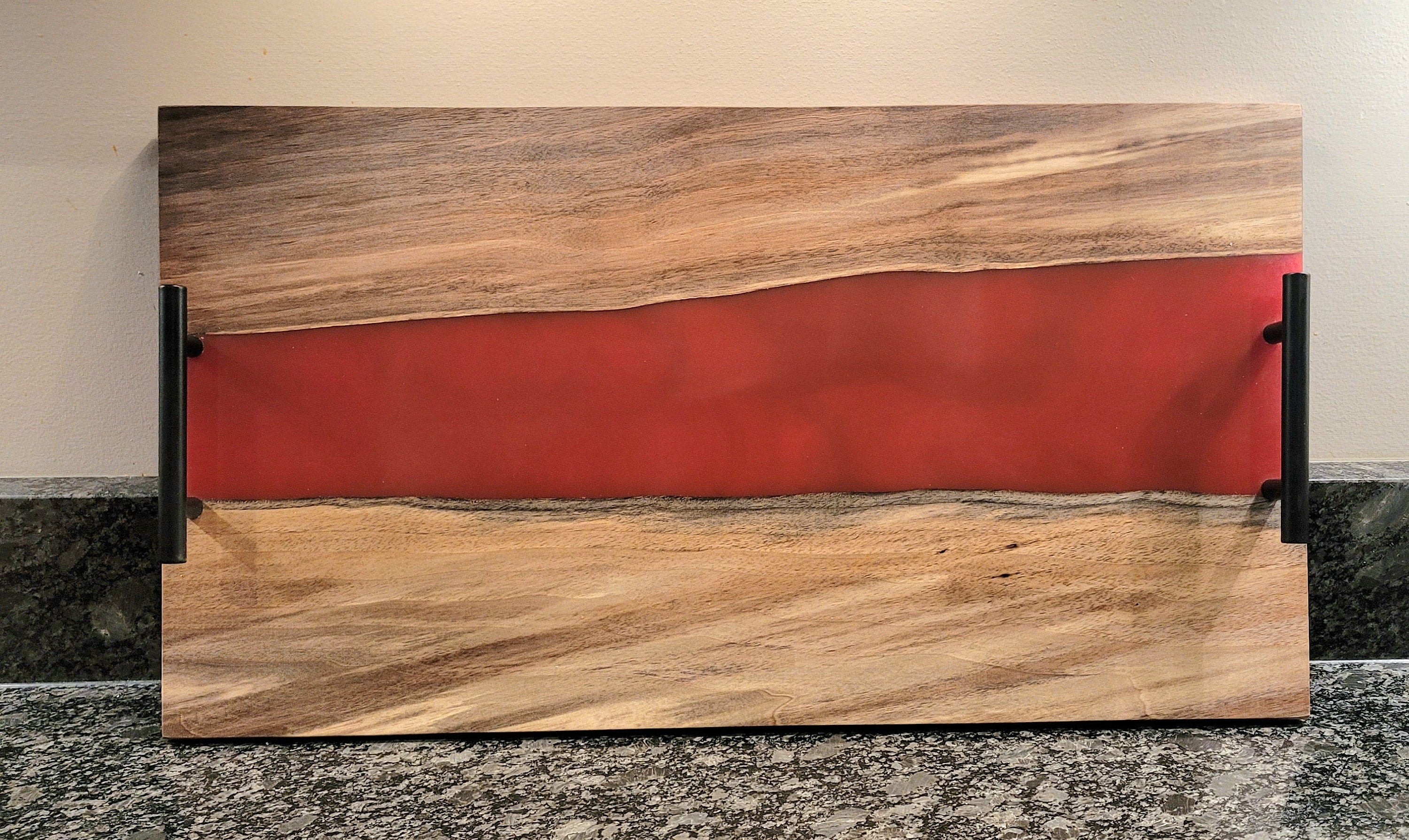 Black Walnut Epoxy River Charcuterie Board Wood Sign — shown on a rustic wall