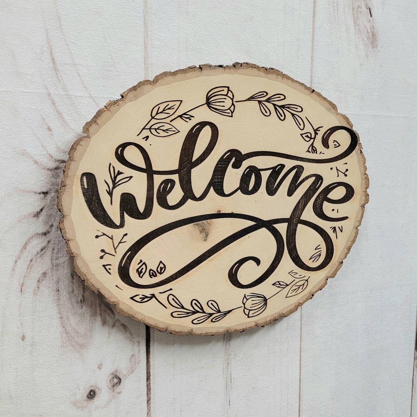 Live Edge Wood Welcome Sign Wood Sign — shown on a rustic wall