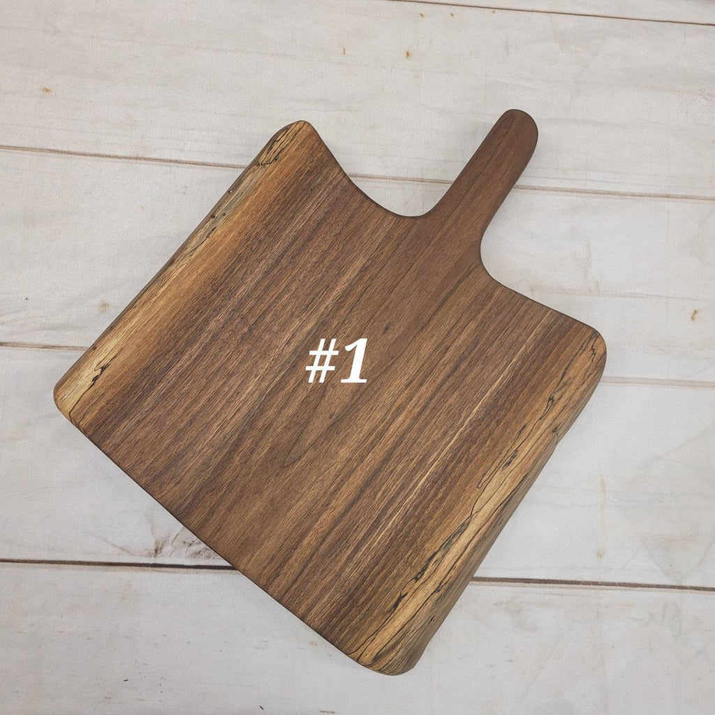 Live Edge Walnut Charcuterie Board Wood Sign — shown on a rustic wall