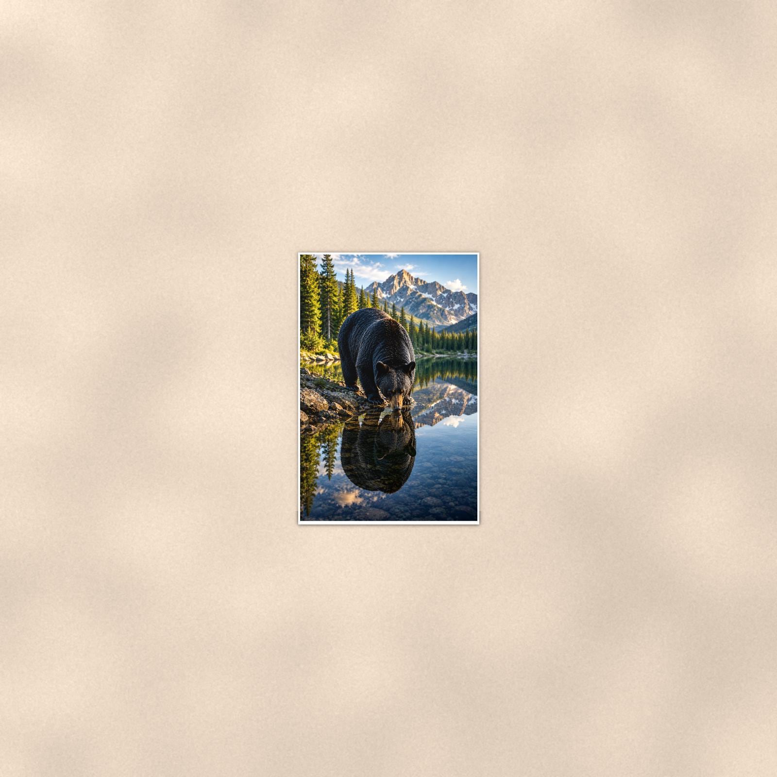 Lake Reflection Bear — 24x36 in art print poster, premium luster paper with a white border; poster seen from further back, at true 24x36 in scale on a warm wall.