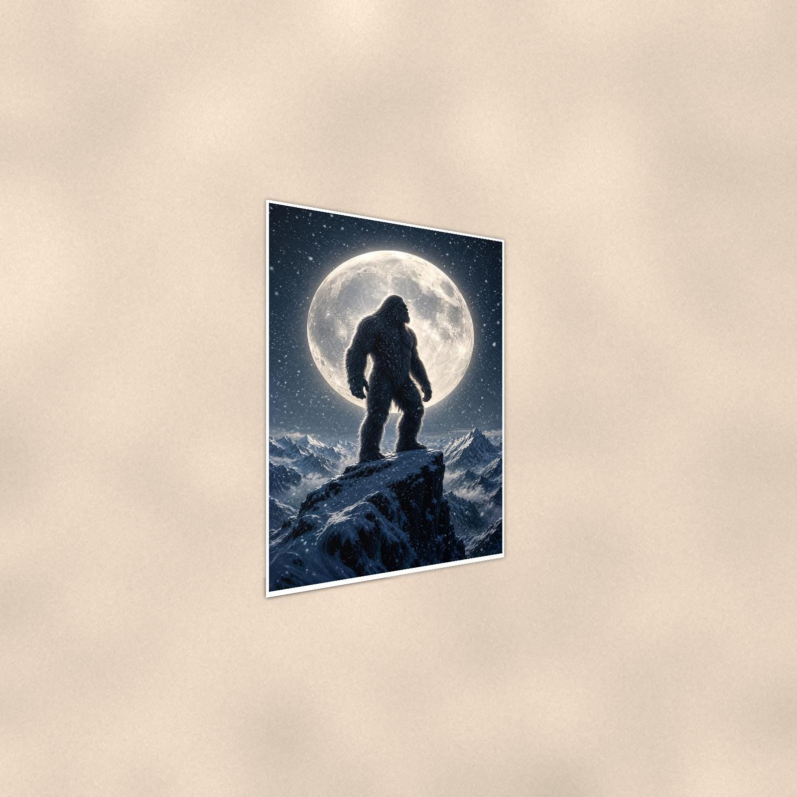 Full Moon Bigfoot — 24x36 in art print poster, premium luster paper with a white border; steeper three-quarter angle on a warm wall, catching the luster sheen.