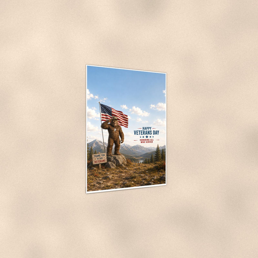 Veterans Day Bigfoot — 24x36 in art print poster, premium luster paper with a white border; gentle three-quarter angle on a warm wall, showing the flat paper edge.