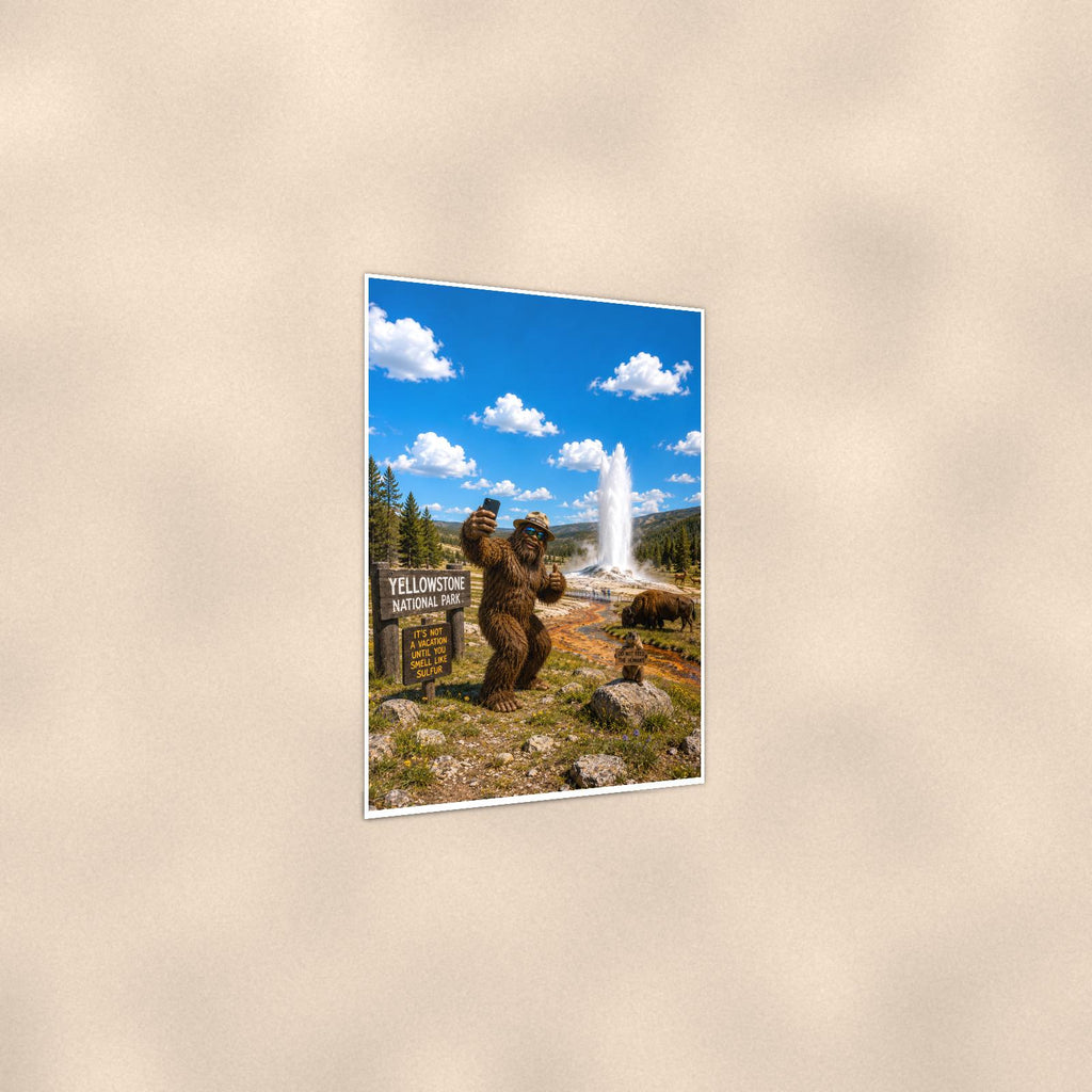 Yellowstone Bigfoot — 24x36 in art print poster, premium luster paper with a white border; gentle three-quarter angle on a warm wall, showing the flat paper edge.