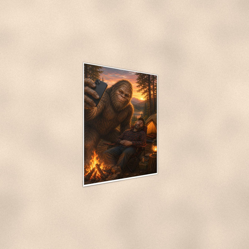 Selfie Bigfoot — 24x36 in art print poster, premium luster paper with a white border; steeper three-quarter angle on a warm wall, catching the luster sheen.