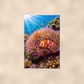 Clownfish and Anemone — 24x36 in art print poster, premium luster paper with a white border; poster shown straight on against a warm wall.