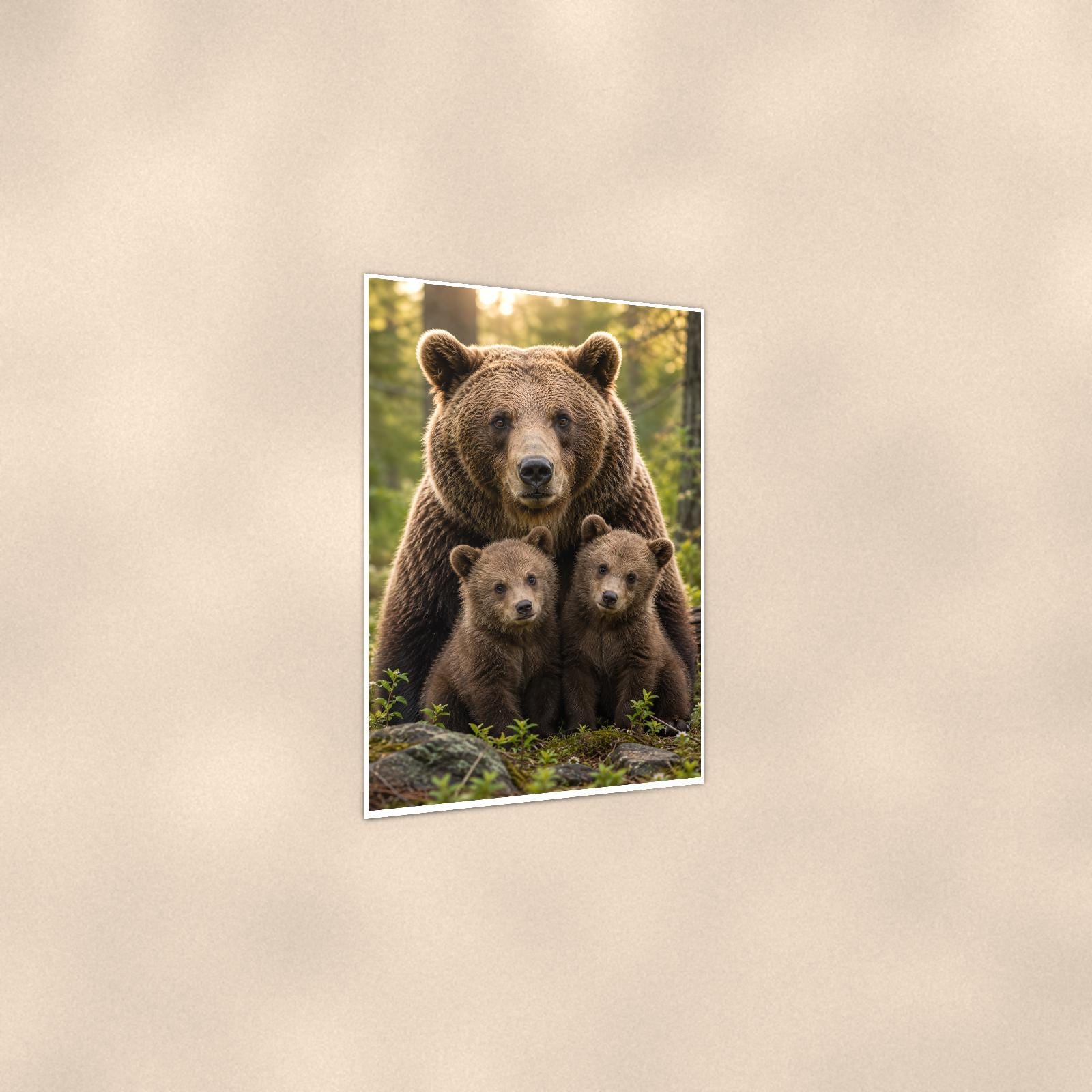 Mama Bear and Cubs — 24x36 in art print poster, premium luster paper with a white border; gentle three-quarter angle on a warm wall, showing the flat paper edge.