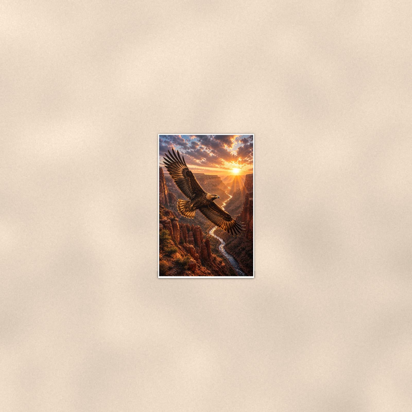 Canyon Eagle Sunset — 24x36 in art print poster, premium luster paper with a white border; poster seen from further back, at true 24x36 in scale on a warm wall.