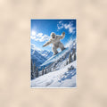 Snowboard Jump Yeti — 24x36 in art print poster, premium luster paper with a white border; poster shown straight on against a warm wall.