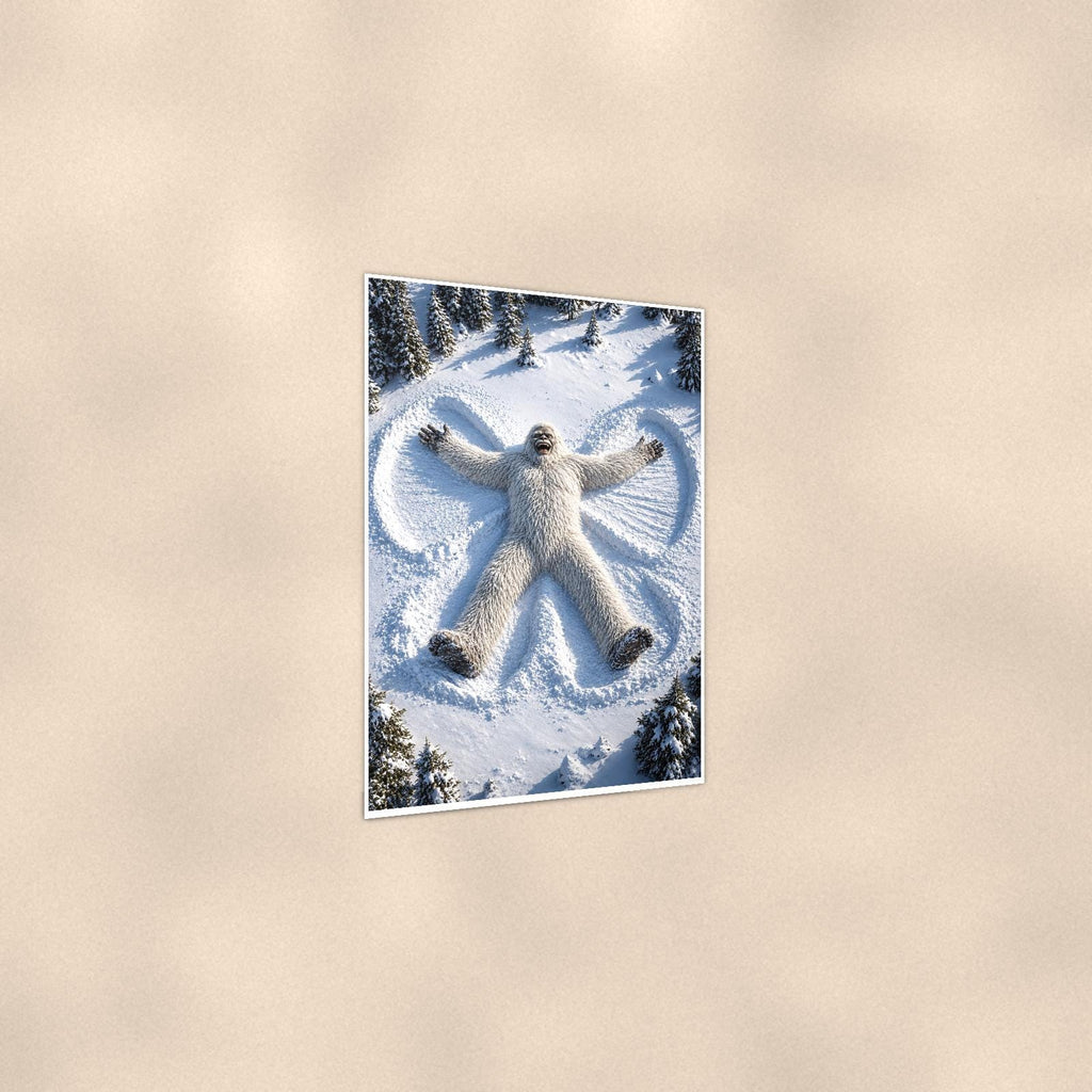 Snow Angel Yeti — 24x36 in art print poster, premium luster paper with a white border; gentle three-quarter angle on a warm wall, showing the flat paper edge.