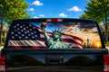 Statue of Liberty Flag Sunrise perforated rear-window decal installed on a pickup truck back glass