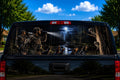 Midnight Coon Hunt perforated rear-window decal installed on a pickup truck back glass