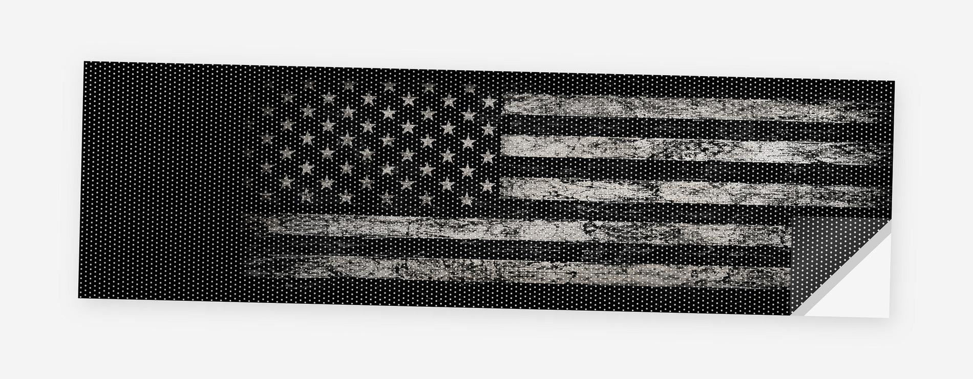 White Distressed Flag on Black 68 x 18.5 inch perforated vinyl truck decal printed flat on white, corner folded up showing the perforation pattern and liner