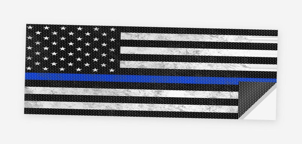 Thin Blue Line Flag 68 x 18.5 inch perforated vinyl truck decal printed flat on white, corner folded up showing the perforation pattern and liner