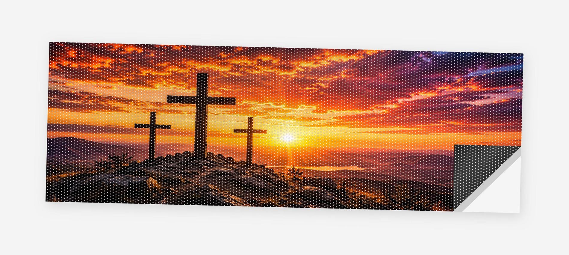 Three Crosses at Sunset 68 x 18.5 inch perforated vinyl truck decal printed flat on white, corner folded up showing the perforation pattern and liner