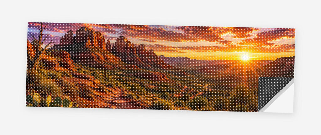 Red Rock Canyon Sunset 68 x 18.5 inch perforated vinyl truck decal printed flat on white, corner folded up showing the perforation pattern and liner