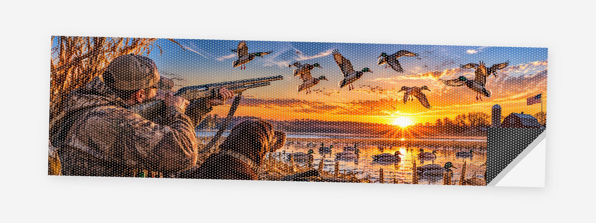 Duck Hunters at Dawn 68 x 18.5 inch perforated vinyl truck decal printed flat on white, corner folded up showing the perforation pattern and liner