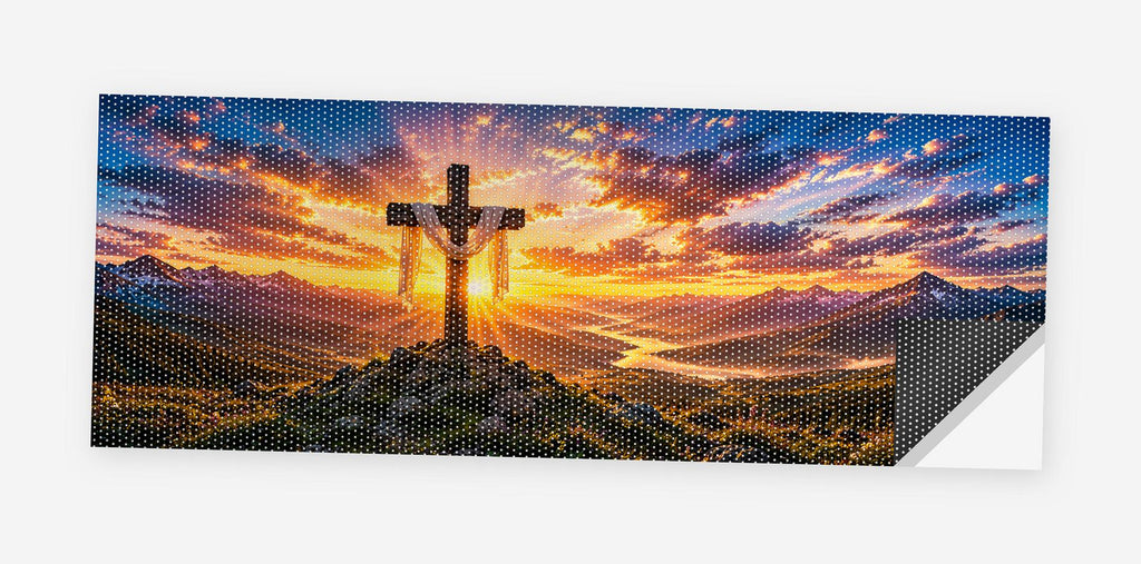 Cross on the Hill 68 x 18.5 inch perforated vinyl truck decal printed flat on white, corner folded up showing the perforation pattern and liner