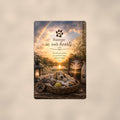 Puppy dog bed under a rainbow memorial art titled "Forever in our hearts" on a 8x12 inch sublimated aluminum sign with rounded corners and mounting holes, shown straight on against a warm neutral wall