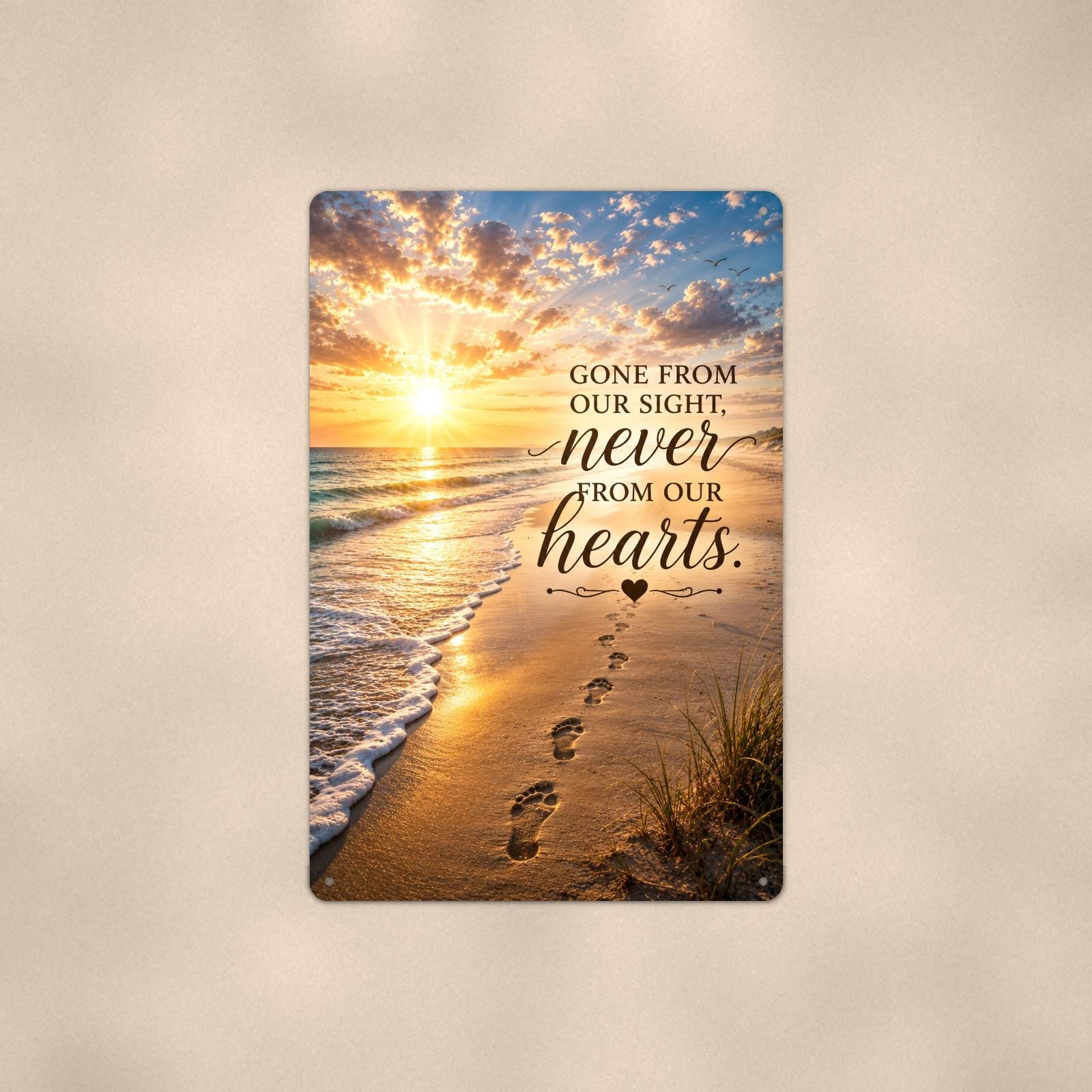 Footprints in the sand at sunset memorial art titled "Gone from our sight, never from our hearts" on a 8x12 inch sublimated aluminum sign with rounded corners and mounting holes, shown straight on against a warm neutral wall