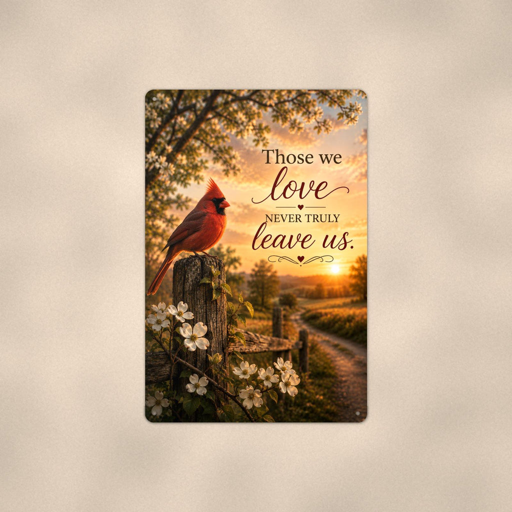 Red cardinal on a blossoming fence post memorial art titled "Those we love never truly leave us" on a 8x12 inch sublimated aluminum sign with rounded corners and mounting holes, shown straight on against a warm neutral wall