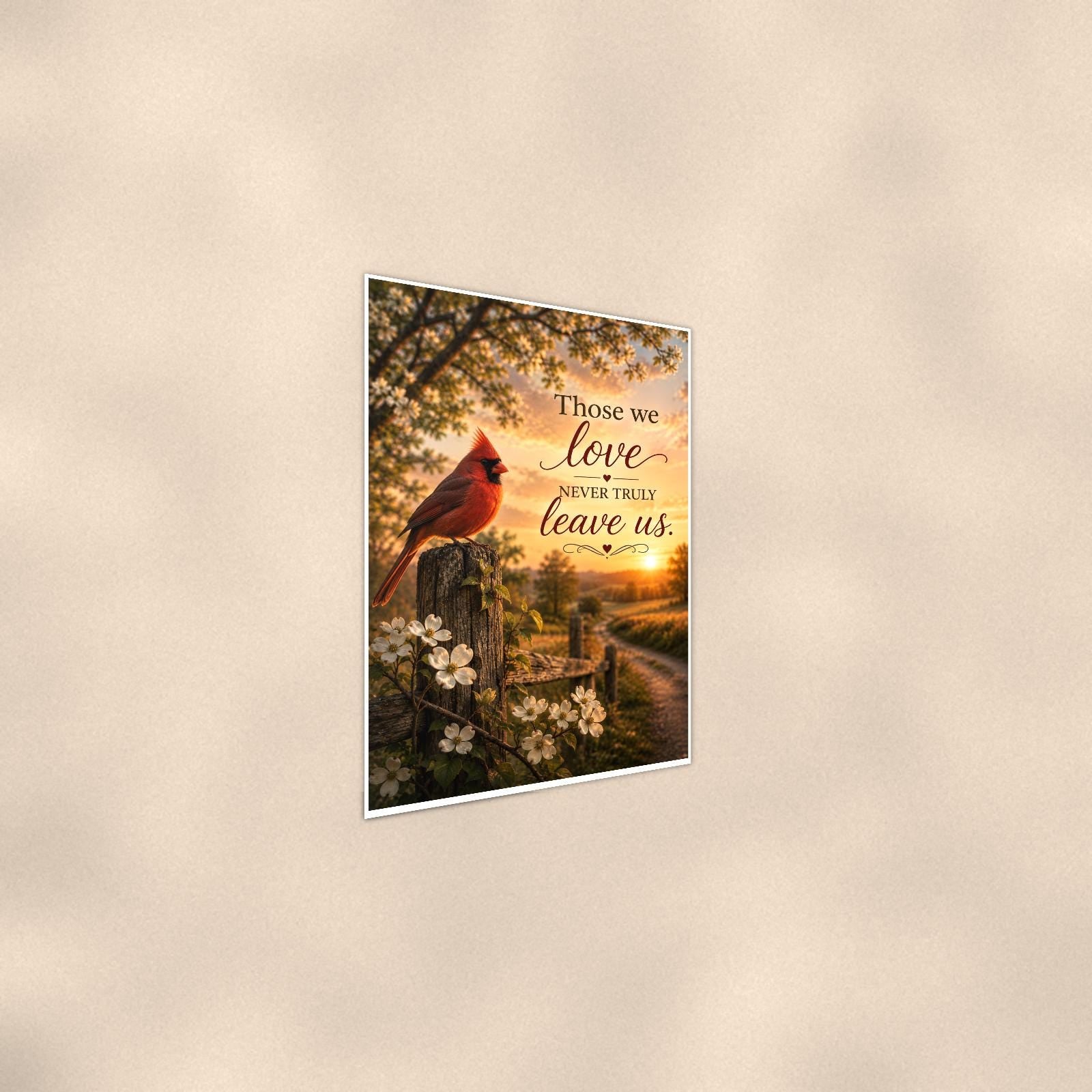 Red cardinal on a blossoming fence post memorial art titled "Those we love never truly leave us" on a 24x36 inch luster poster print with a clean white border, shown at a gentle angle from the other side