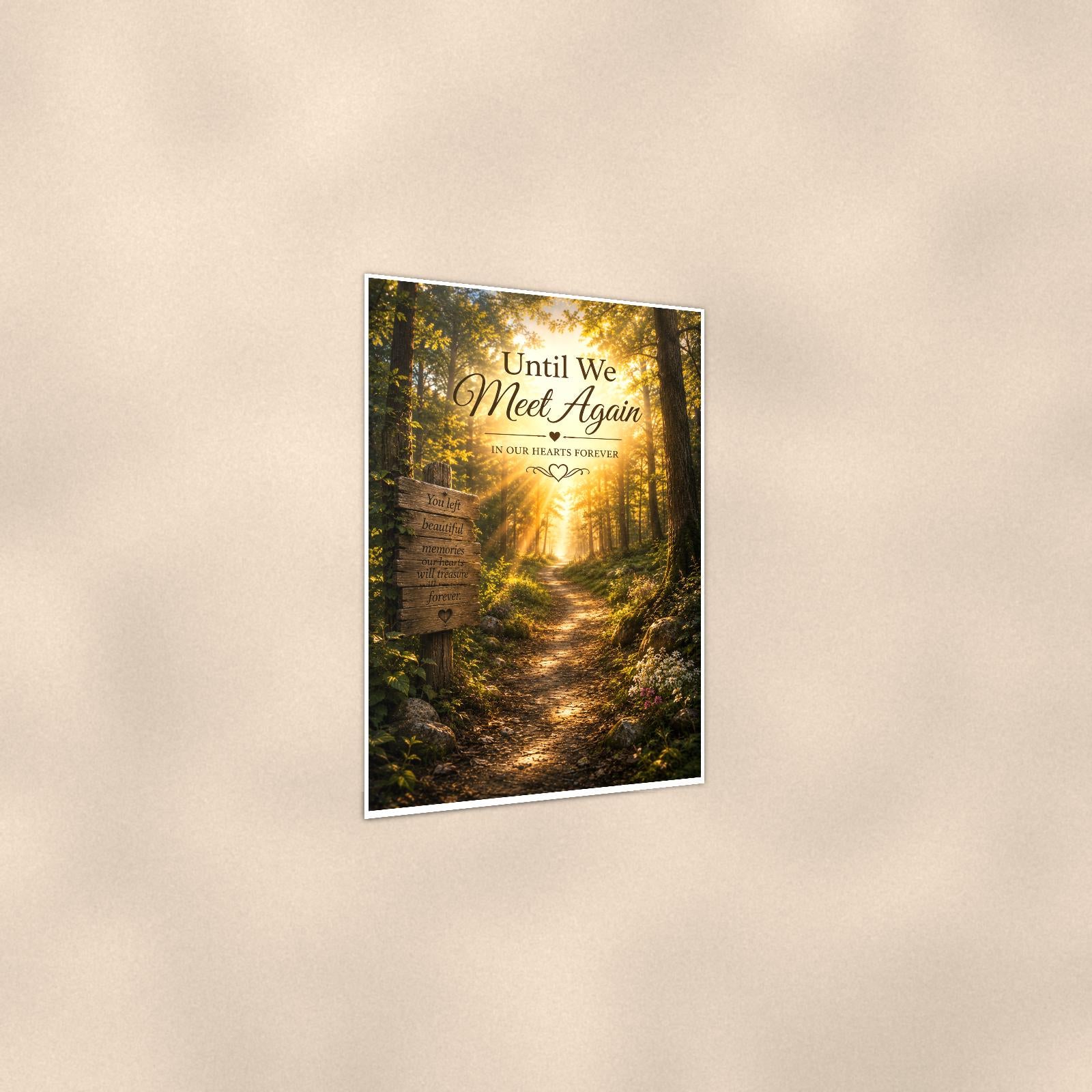 Sunlit forest path with a rustic memory sign memorial art titled "Until We Meet Again - In Our Hearts Forever" on a 24x36 inch luster poster print with a clean white border, shown at a three-quarter angle on the wall