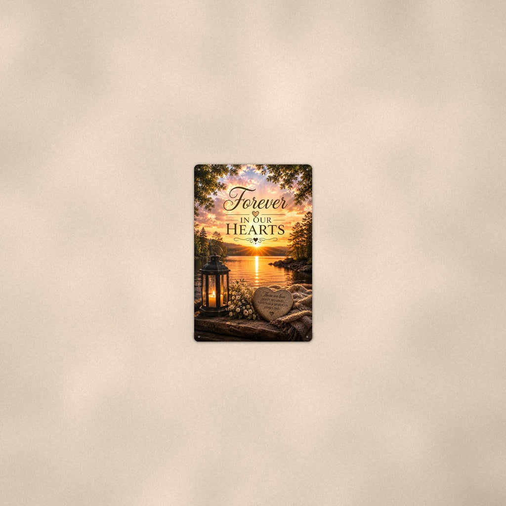 Lakeside lantern and heart stone memorial art titled "Forever In Our Hearts" on a 8x12 inch sublimated aluminum sign with rounded corners and mounting holes, seen from farther back, small on a softly lit wall