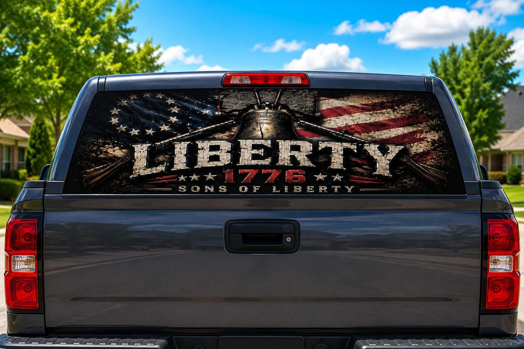 Liberty 1776 Sons of Liberty perforated rear-window decal installed on a pickup truck back glass, showing the Liberty Bell over crossed muskets and a distressed Betsy Ross flag