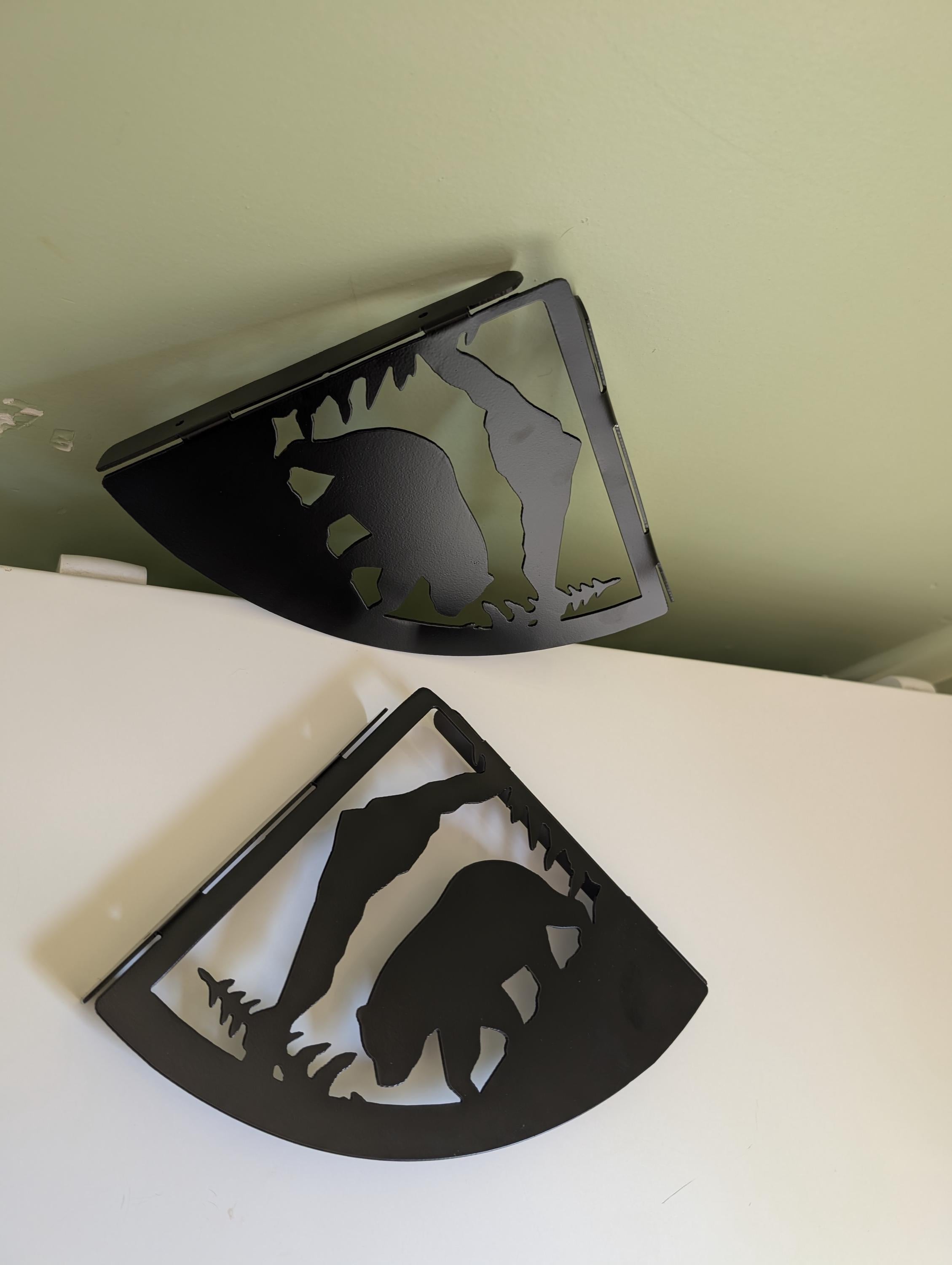 Mountain bear shelf bracket mounted on the wall, angled view