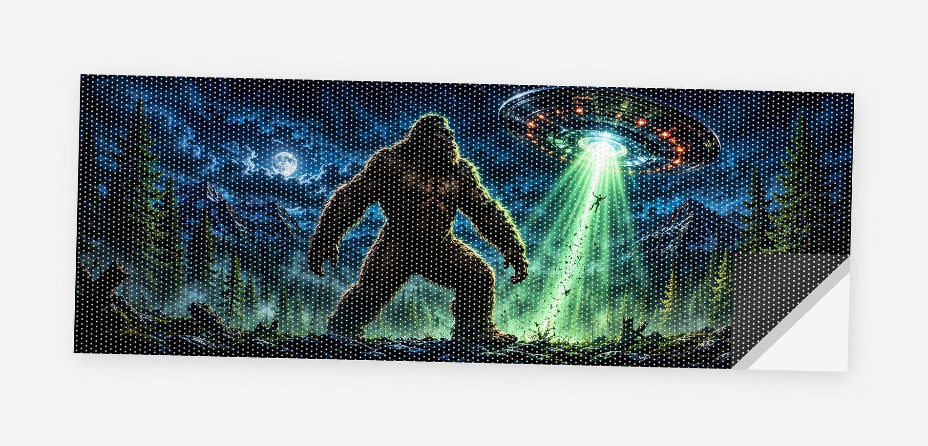 Full flat view of the Bigfoot UFO Abduction perforated truck window decal on a white background, one corner curled to show the black perf-vinyl backing and the micro-hole pattern