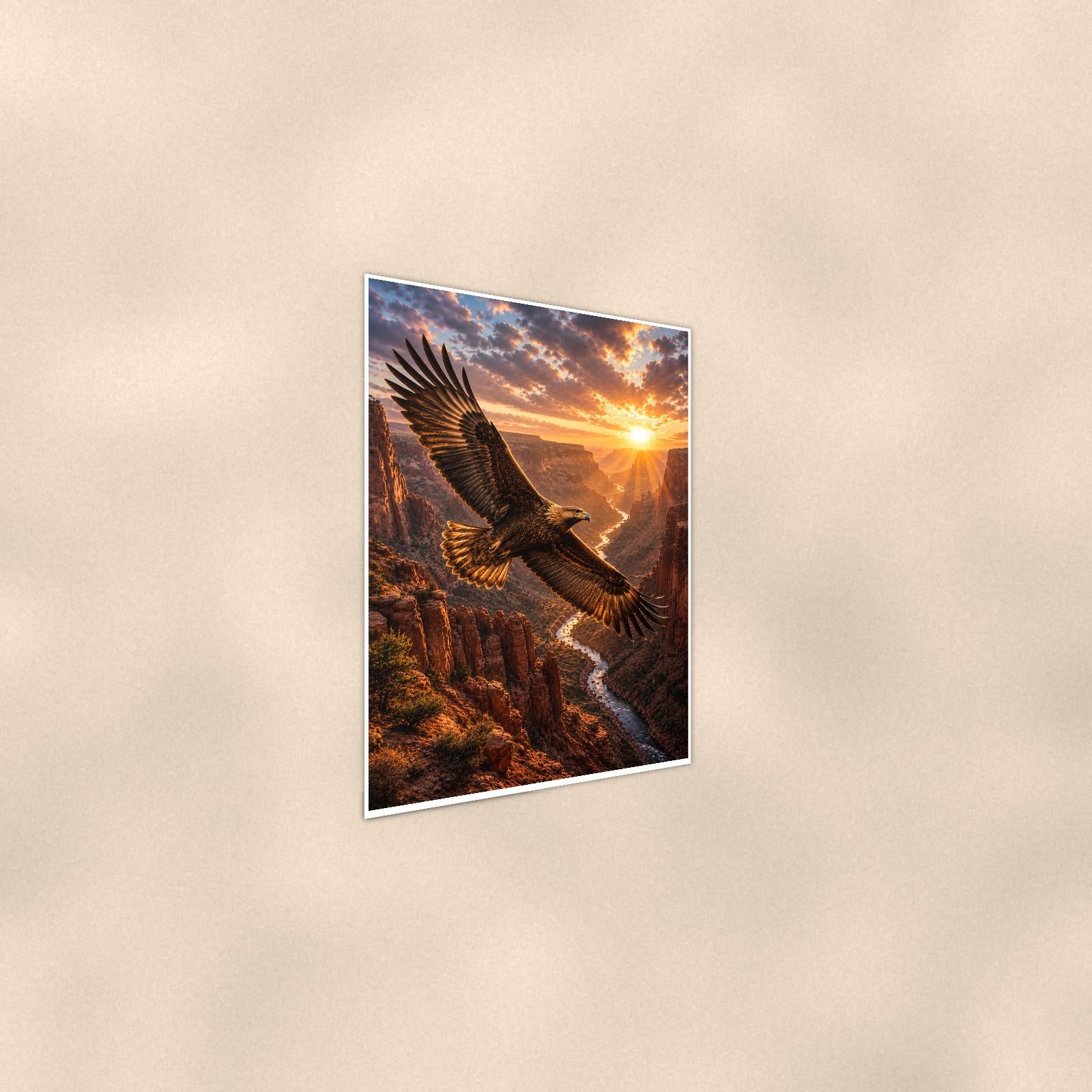 Canyon Eagle Sunset — 24x36 in art print poster, premium luster paper with a white border; steeper three-quarter angle on a warm wall, catching the luster sheen.