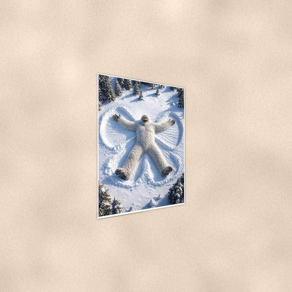 Snow Angel Yeti — 24x36 in art print poster, premium luster paper with a white border; steeper three-quarter angle on a warm wall, catching the luster sheen.