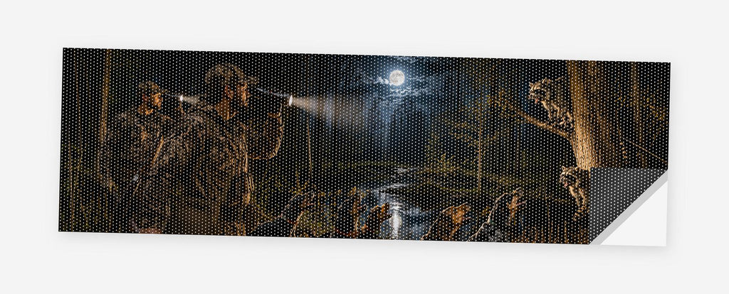 Midnight Coon Hunt 68 x 18.5 inch perforated vinyl truck decal printed flat on white, corner folded up showing the perforation pattern and liner