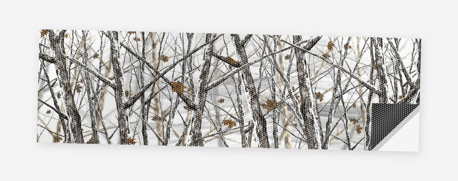 Winter Birch and Birds 68 x 18.5 inch perforated vinyl truck decal printed flat on white, corner folded up showing the perforation pattern and liner