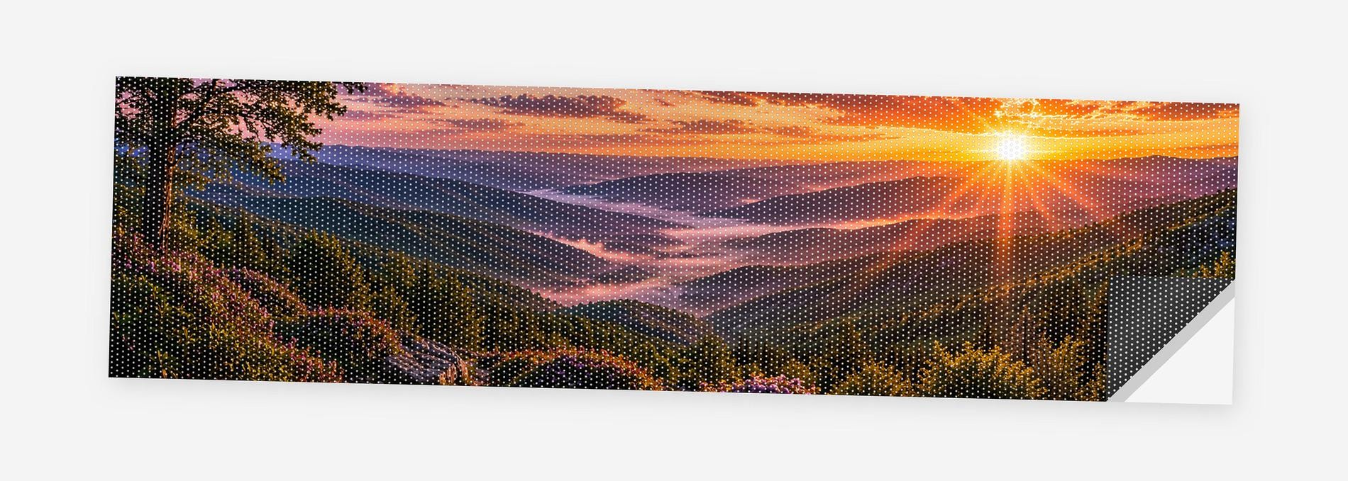 Blue Ridge Sunset 68 x 18.5 inch perforated vinyl truck decal printed flat on white, corner folded up showing the perforation pattern and liner