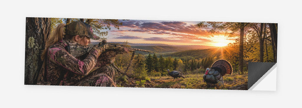 Turkey Hunter in Camo 68 x 18.5 inch perforated vinyl truck decal printed flat on white, corner folded up showing the perforation pattern and liner