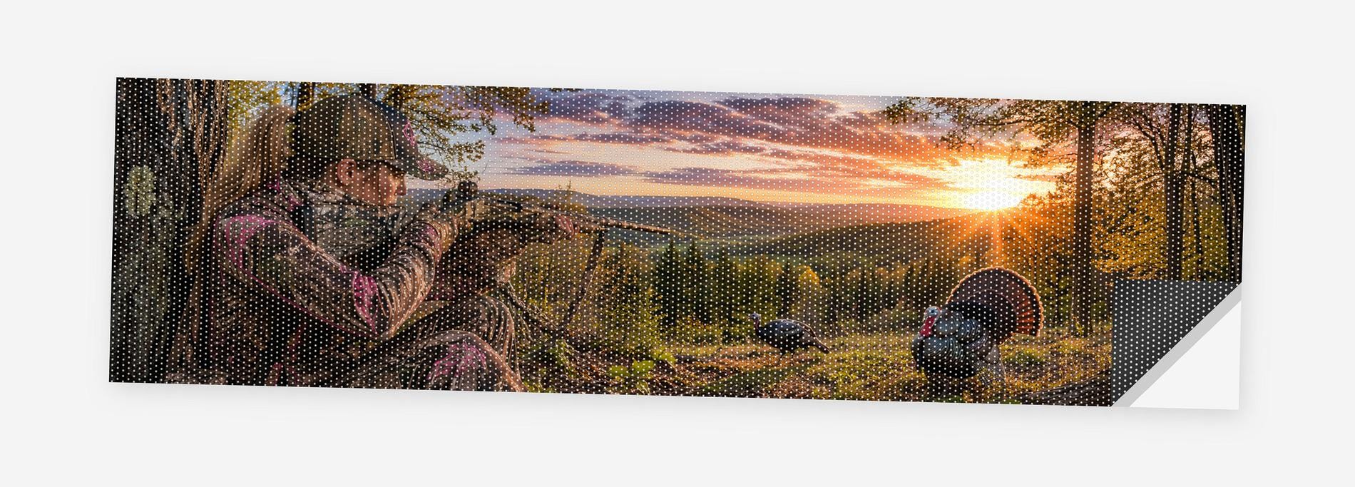 Turkey Hunter in Camo 68 x 18.5 inch perforated vinyl truck decal printed flat on white, corner folded up showing the perforation pattern and liner