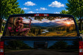 Country Girl Bowhunter perforated rear-window decal installed on a pickup truck back glass
