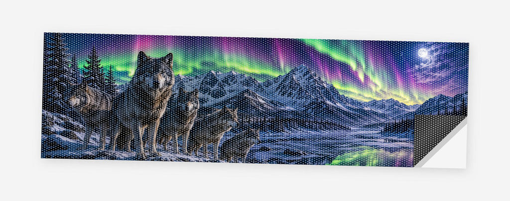 Wolves Under the Aurora 68 x 18.5 inch perforated vinyl truck decal printed flat on white, corner folded up showing the perforation pattern and liner