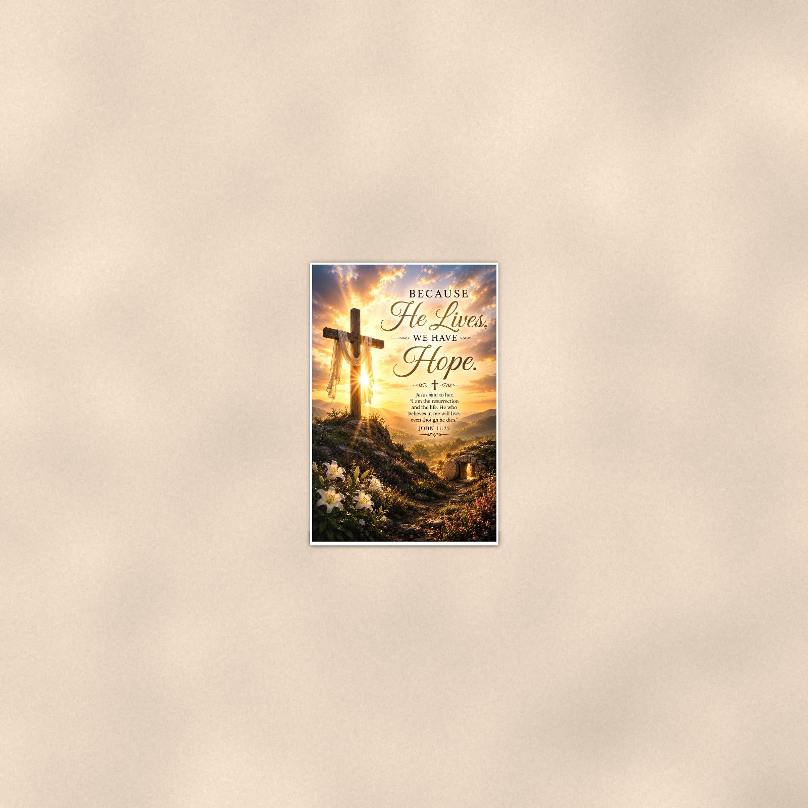 Wooden cross on a sunlit hilltop with the empty tomb memorial art titled "Because He Lives, We Have Hope" on a 24x36 inch luster poster print with a clean white border, seen from farther back, small on a softly lit wall