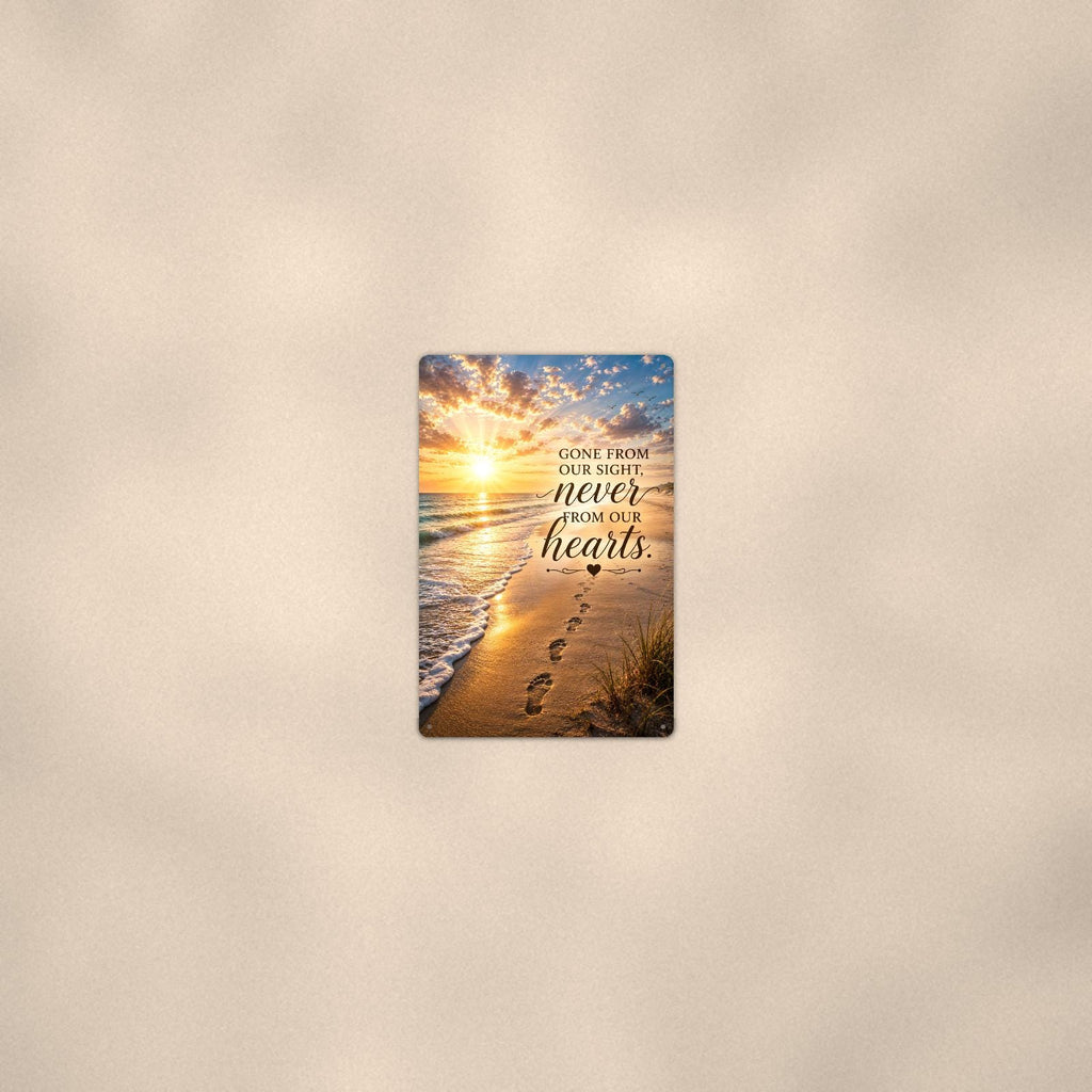 Footprints in the sand at sunset memorial art titled "Gone from our sight, never from our hearts" on a 8x12 inch sublimated aluminum sign with rounded corners and mounting holes, seen from farther back, small on a softly lit wall