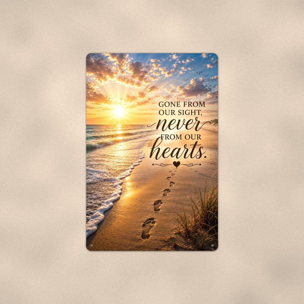 Footprints in the sand at sunset memorial art titled "Gone from our sight, never from our hearts" on a 8x12 inch sublimated aluminum sign with rounded corners and mounting holes, shown straight on against a second warm wall tone