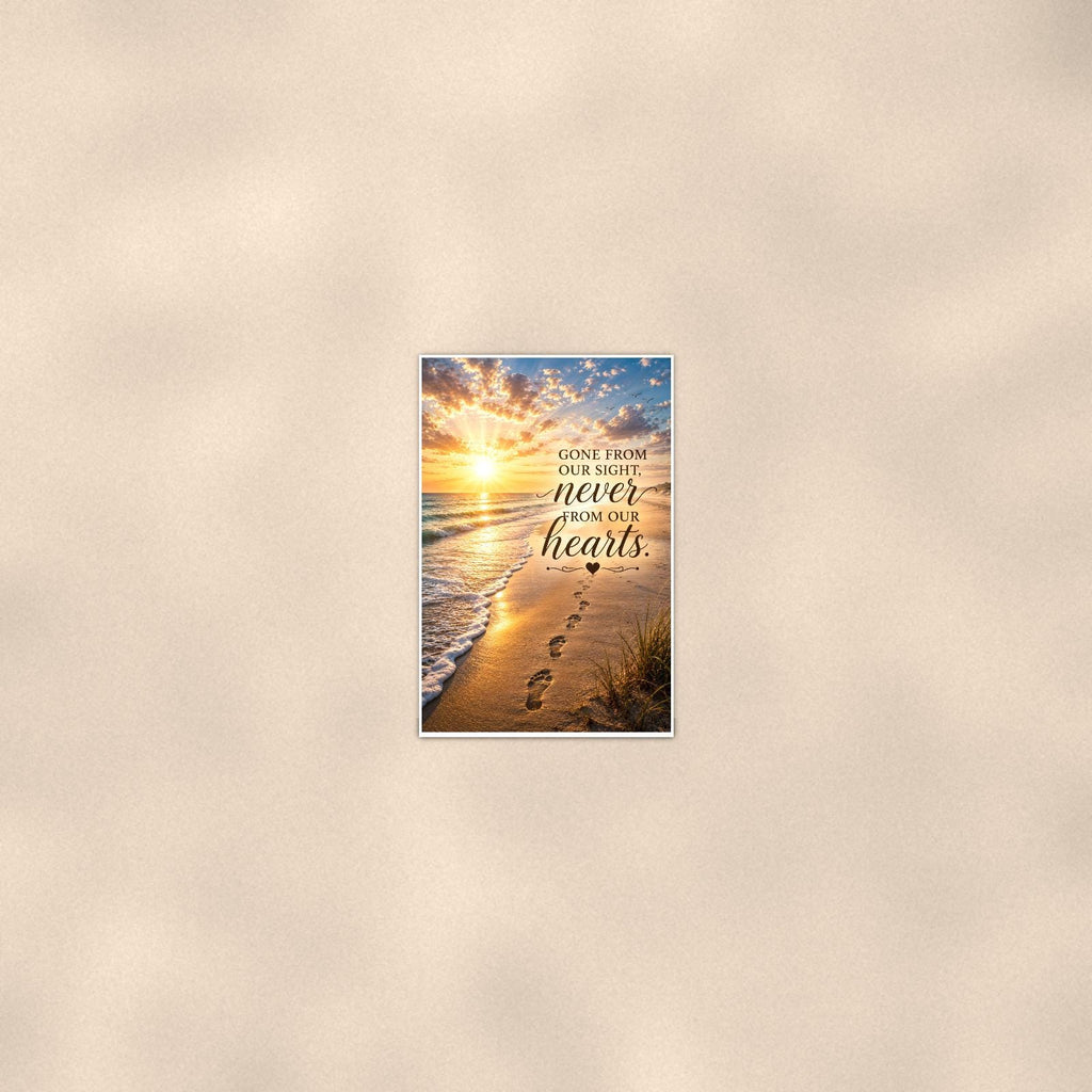 Footprints in the sand at sunset memorial art titled "Gone from our sight, never from our hearts" on a 24x36 inch luster poster print with a clean white border, seen from farther back, small on a softly lit wall