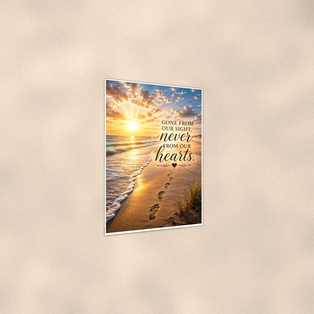 Footprints in the sand at sunset memorial art titled "Gone from our sight, never from our hearts" on a 24x36 inch luster poster print with a clean white border, shown at a three-quarter angle on the wall