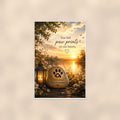 Paw print memorial stone by the lake memorial art titled "You left paw prints on our hearts" on a 24x36 inch luster poster print with a clean white border, shown straight on against a warm neutral wall