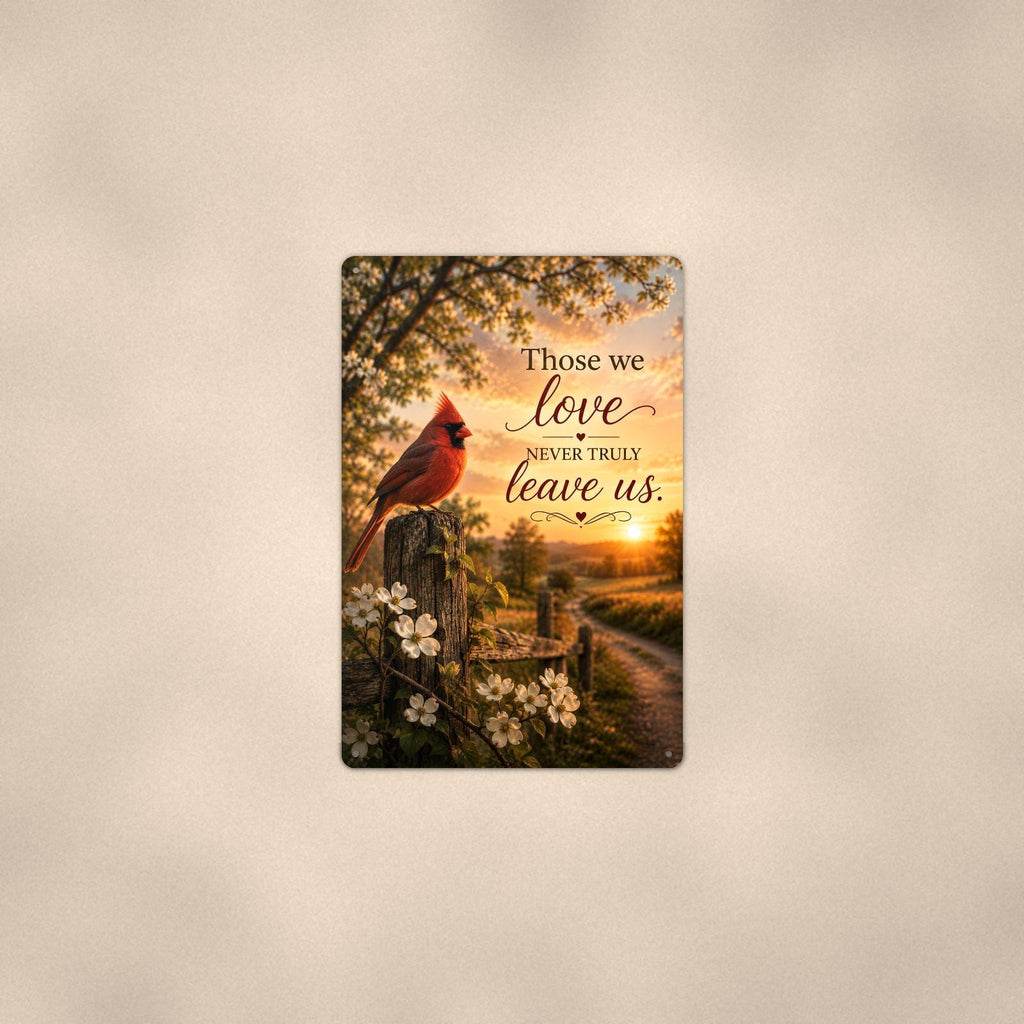Red cardinal on a blossoming fence post memorial art titled "Those we love never truly leave us" on a 8x12 inch sublimated aluminum sign with rounded corners and mounting holes, shown at mid-distance centered on a warm wall