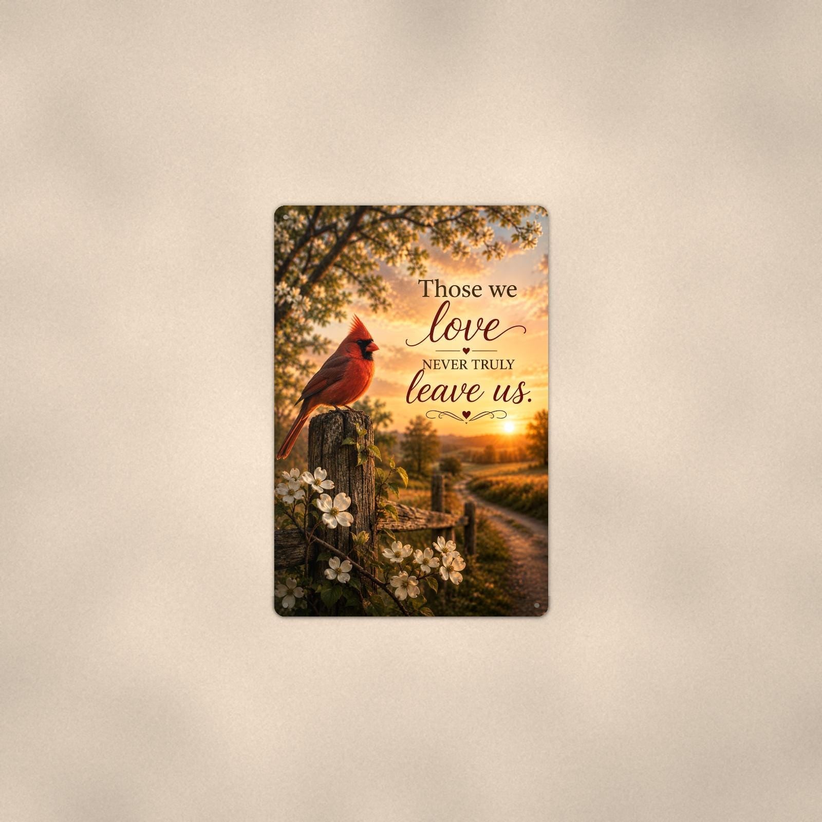 Red cardinal on a blossoming fence post memorial art titled "Those we love never truly leave us" on a 8x12 inch sublimated aluminum sign with rounded corners and mounting holes, shown at mid-distance centered on a warm wall