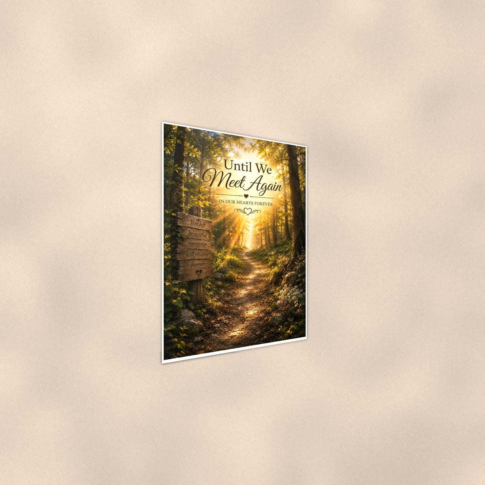 Sunlit forest path with a rustic memory sign memorial art titled "Until We Meet Again - In Our Hearts Forever" on a 24x36 inch luster poster print with a clean white border, shown at a gentle angle from the other side