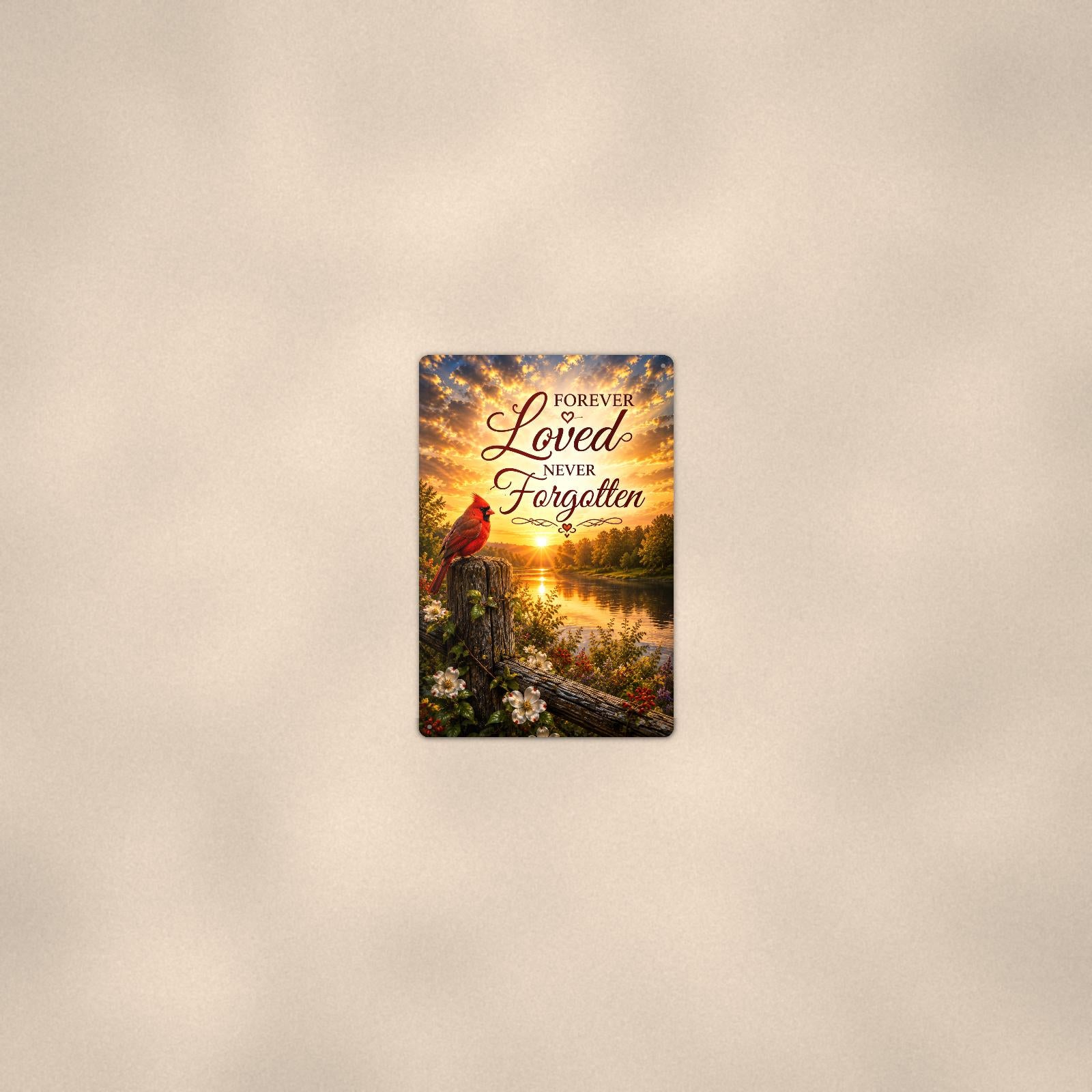 Cardinal at sunrise over the river memorial art titled "Forever Loved Never Forgotten" on a 8x12 inch sublimated aluminum sign with rounded corners and mounting holes, seen from farther back, small on a softly lit wall