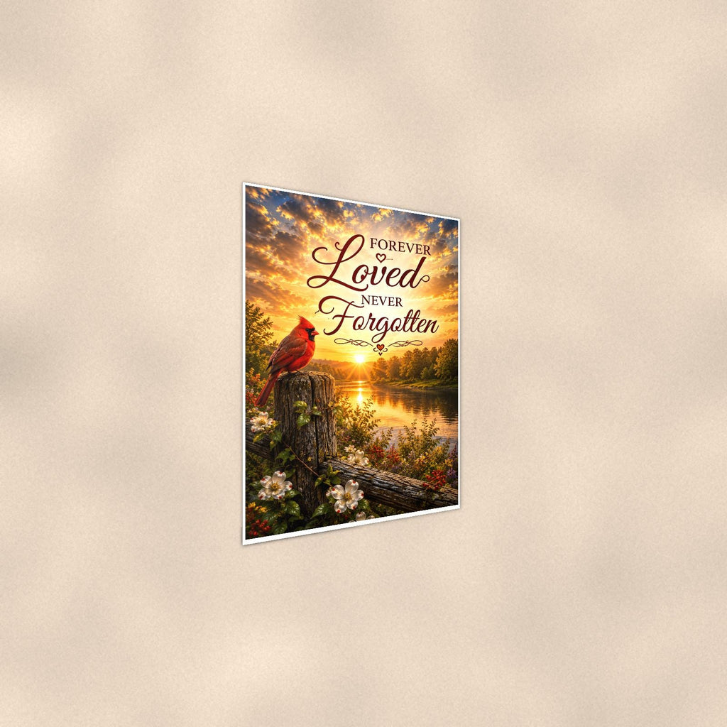 Cardinal at sunrise over the river memorial art titled "Forever Loved Never Forgotten" on a 24x36 inch luster poster print with a clean white border, shown at a gentle angle from the other side